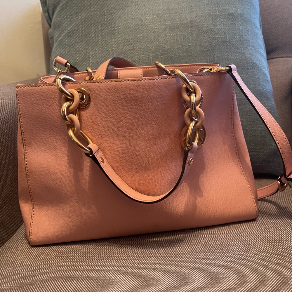 This Michael Kors bag is for anyone that loves pink or wants a pop of color